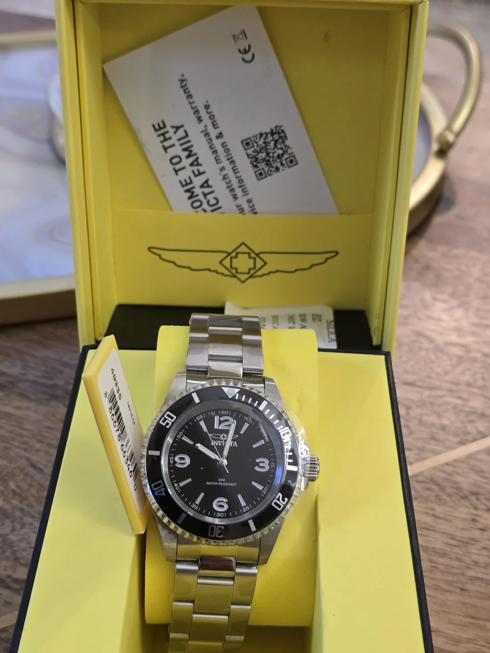 Invicta Silver Stainless Steel Watch with Black Dial and Bezel